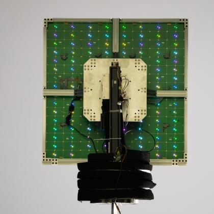 A scanning reflectarray antenna lights up with its individual reflective elements.