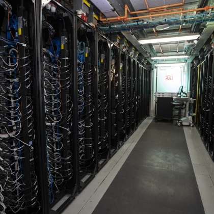 A row of server racks inside the Lincoln Laboratory Supercomputing Center
