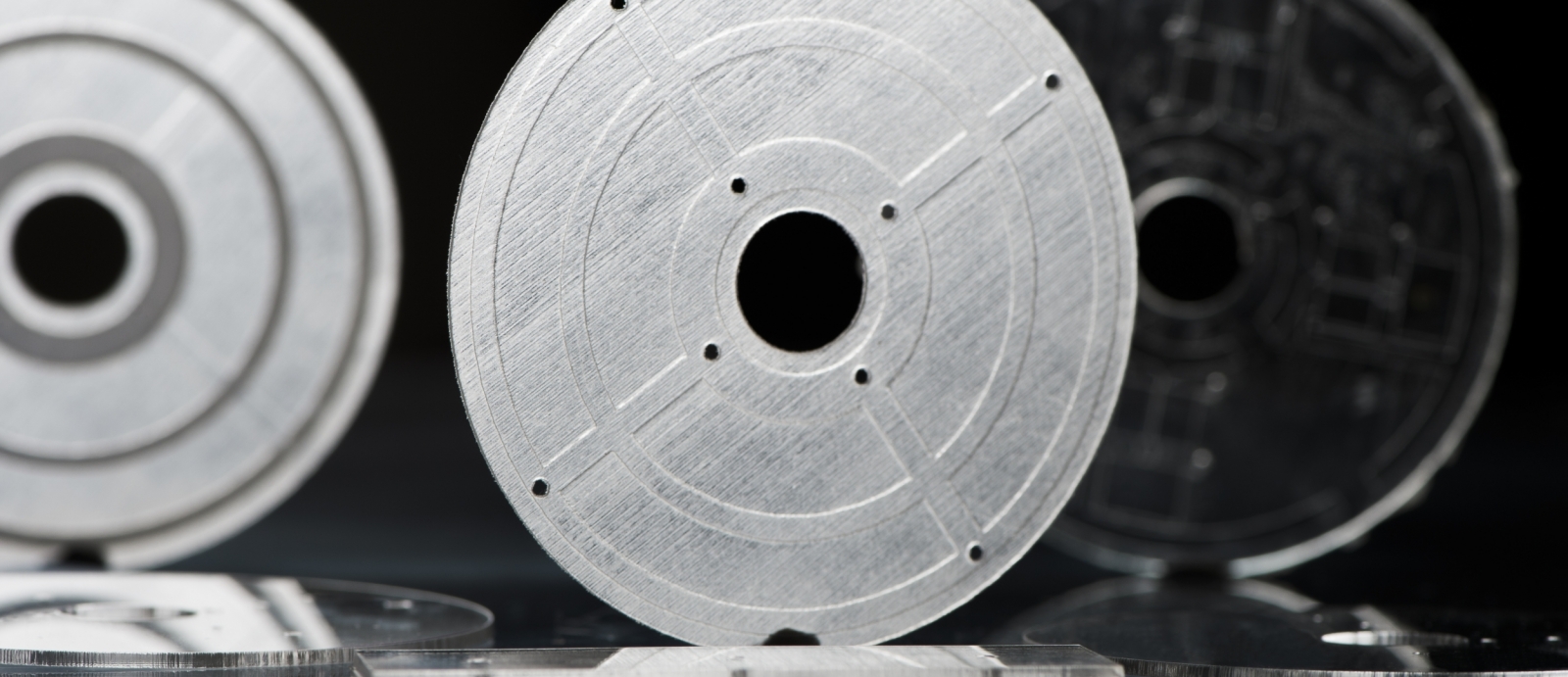 three disc-shaped microfluidic device that were 3D printed