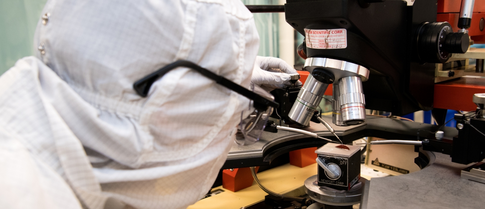 Annie Weathers measures the battery performance of a hydrogen nanobattery patterned on a silicon wafer. Photo: Nicole Fandel