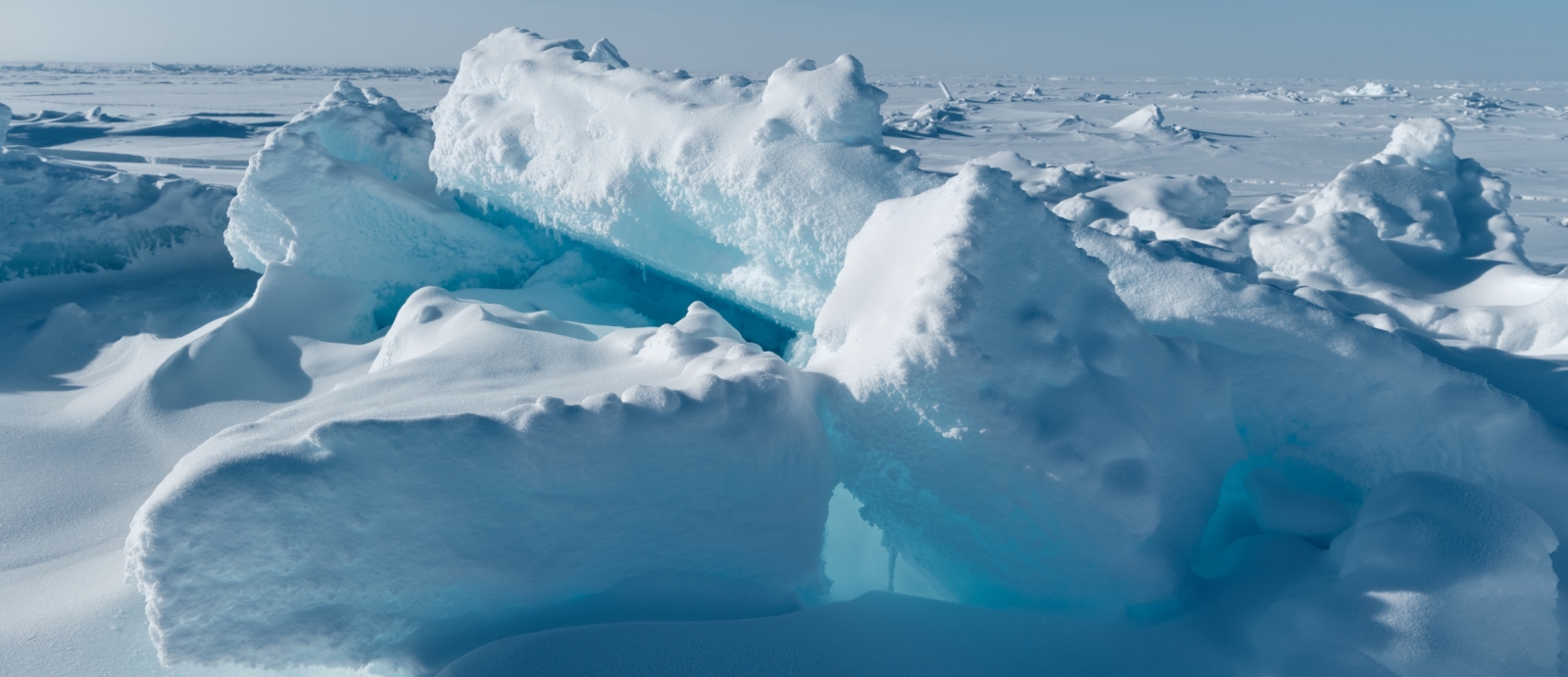 A photo of Arctic sea ice fracturing into big chunks.