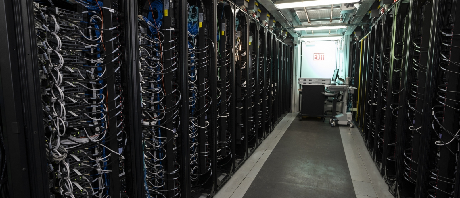 A row of server racks inside the Lincoln Laboratory Supercomputing Center