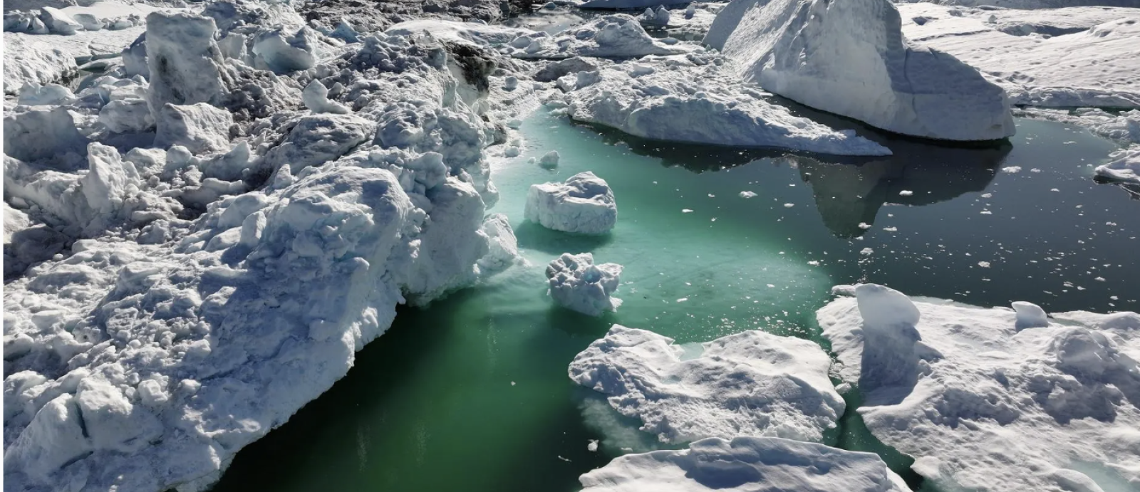 Chunks of fractured sea ice create passageways through the water.