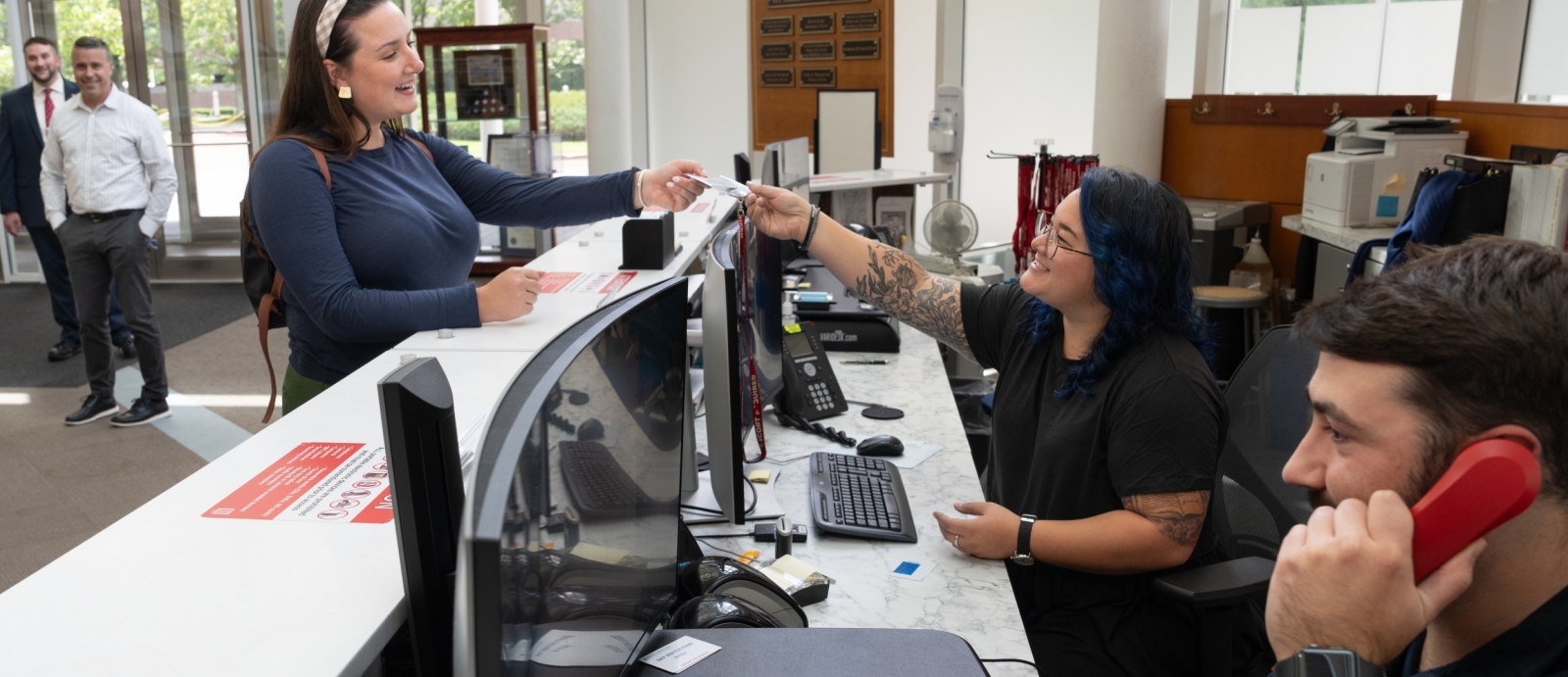 Someone approaches the desk in Lincoln Laboratory's main lobby.