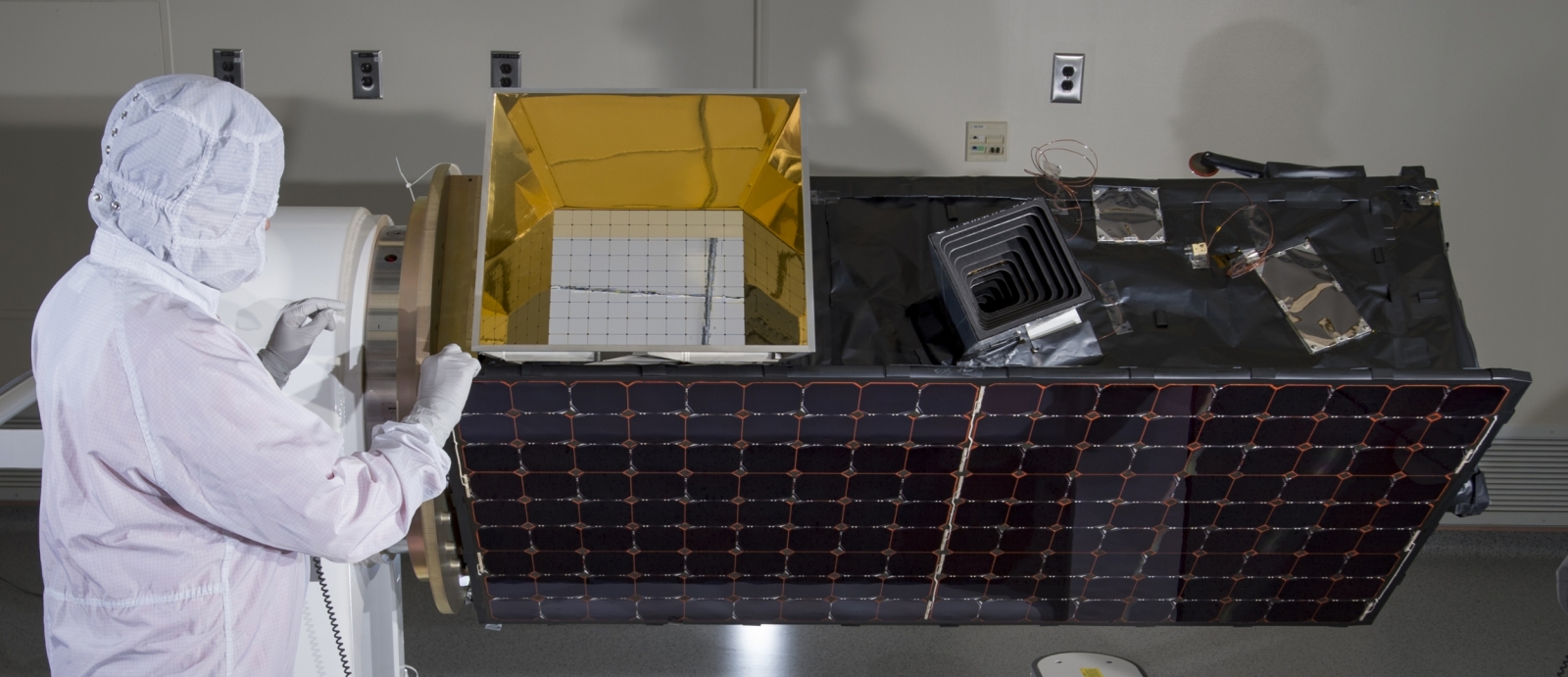 Staff in the Mechanical Engineering Group test a component of the Operationally Responsive Space-5 SensorSat.