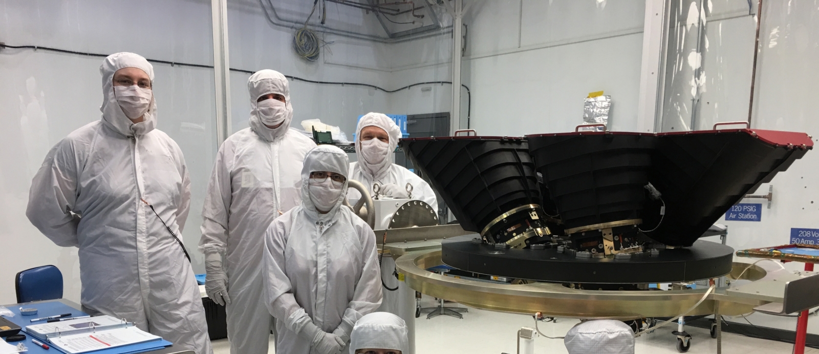 Staff from the Systems Engineering Group with the four wide-field cameras for the Transiting Exoplanet Survey Satellite (TESS).