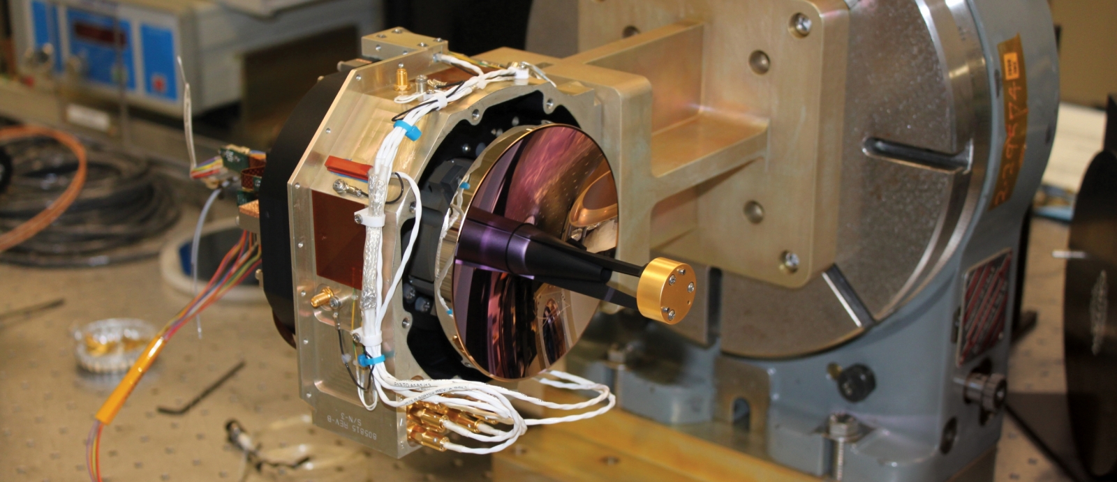 The assembled telescope and optical bench assembly for the Lunar Laser Communications Demonstration is shown here in a test fixture. The primary mirror is 4 inches in diameter.