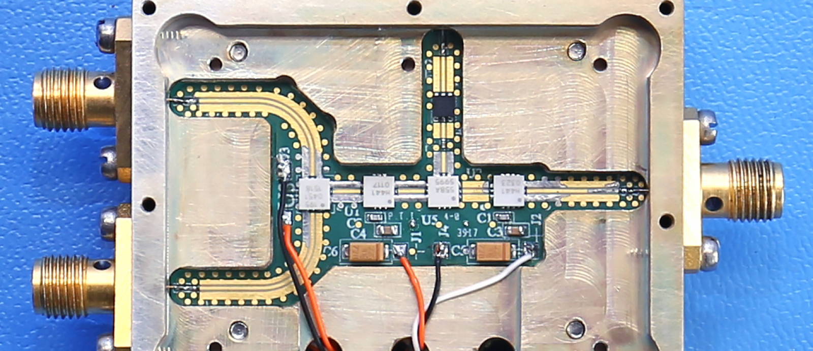 Our group applies expertise in microwave circuit design and fabrication to sensor and electronic warfare systems. Above is an integrated microwave frequency converter based on co-planar microstrip technology. 