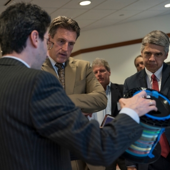 Sasha Stolyarov, left, principal investigator at the DFDC, demonstrated several advanced fibers technologies under development at the DFDC to Secretary Ash, center, and Eric Evans, right, director of Lincoln Laboratory. Photo: Glen Cooper