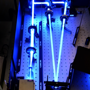 In the holographic writing process, the hardened PPD is exposed to right- and left-handed circular polarization of laser beams, which aligns the Brilliant Yellow molecules into the desired optical steering grid pattern. Image courtesy of the researchers. 