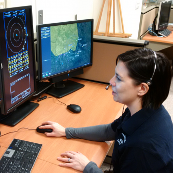 A researcher is operating the GBSAA system as part of the human-in-the-loop test to evaluate the human-machine interface for safety, workload, and general usability. 