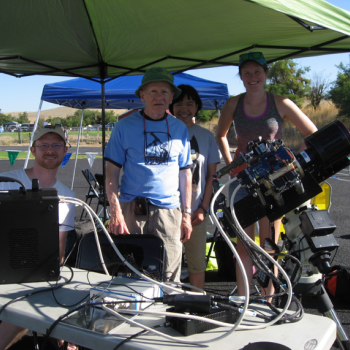 From left to right, Justin Baker, Bert Willard, Jane Luu, and Suzannah Riccardi wait for the eclipse to begin after setting up the DFPA camera.