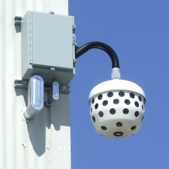 The Immersive Imaging System camera installed on the corner of a building.