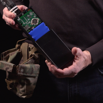a person holding the MNOISE on-body component. 
