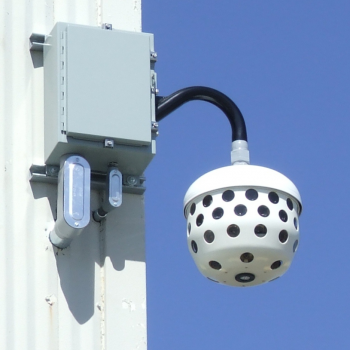 A photo of the IIS camera installed on the side of a building