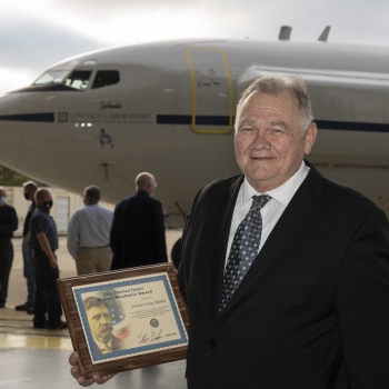 Dennis Hamel, chief mechanic, accepts the Charles Taylor Master Mechanic Award for his many years of service to the aircraft maintenance industry. Photo: Glen Cooper. 