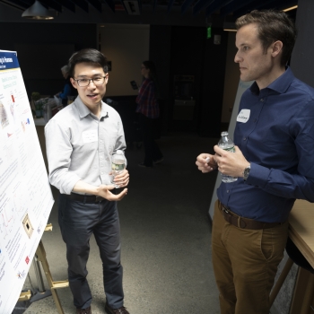 At the poster session, Lincoln Scholar Tom Cheng (left) presents his work on brain-imaging technology. Cheng’s work is part of a larger Laboratory program to build a portable cap that can measure blood flow fluctuations in the brain. 