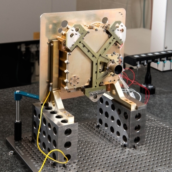 The PCC is mounted onto the DSOC system using a Y-shaped bracket. A tube connected to the Y is a baffle that protects the GmAPD array from stray light emitted from within the spacecraft.