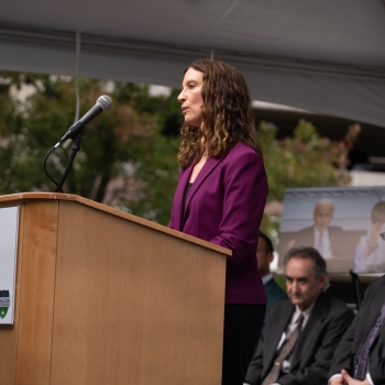 Melissa Choi gives remarks at a podium. 