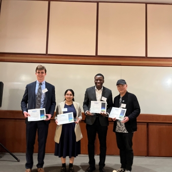 Staff recipients are pictures together holding their awards. 