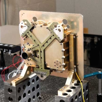 Photo of the photon-counting camera. The Y-shaped bracket mounts the camera to the rest of the deep-space optical communication system. The baffle (tube shape) on the Y protects the camera’s optical path from stray light.