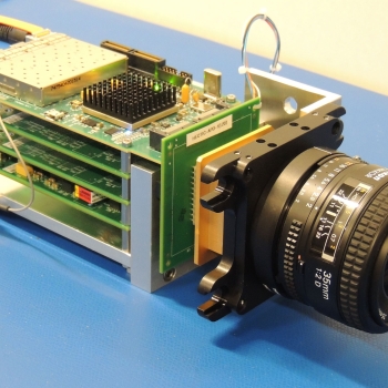 Photo of the lens and electronics of the Dual-Mode Imaging Receiver (only 2 of the 4 boards in the chassis are populated, the other 2 are available for additional functions).