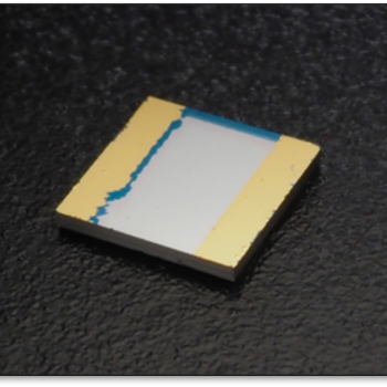 Photograph of a lab-grown diamond sample with a thin layer of magnetically sensitive nitrogen-vacancy (NV) centers.