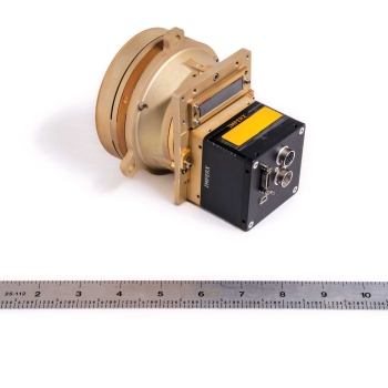Photo of the prototype of the Chrisp Compact VNIR/SWIR Imaging Spectrometer with ruler beneath for scale.