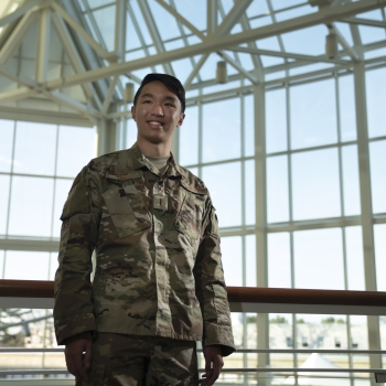 Military Fellow Thieu Albert poses in the entrance atrium at Lincoln Laboratory
