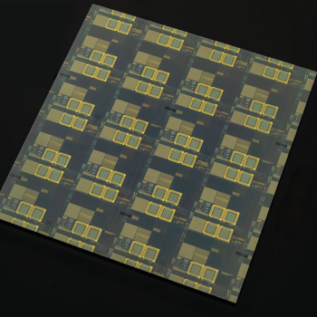 An optical image of integrated circuits on a square of semiconductor material