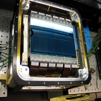The upgraded Space Surveillance Telescope camera contains 12 charge-coupled devices developed by Lincoln Laboratory researchers. The devices are integrated into a precision dewar, above, to create the array for the telescope's focal surface.