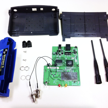 a disassembled wireless router is shown with all its components. 