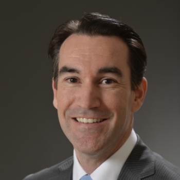 A portrait photograph of Christopher Roeser.