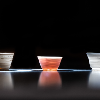 Researchers used the low-temperature additive manufacturing process to build the glass cups above. The optical behavior of the printed cups can be tailored by altering the chemical components of the inks.