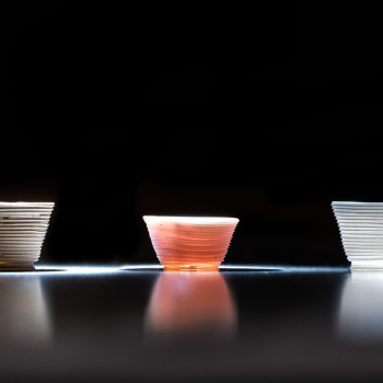 Researchers used the low-temperature additive manufacturing process to build the glass cups above.   The optical behavior of the printed cups can be tailored by altering the chemical components of the inks. 
