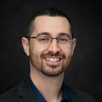 A formal staff portrait of Jaime Pena
