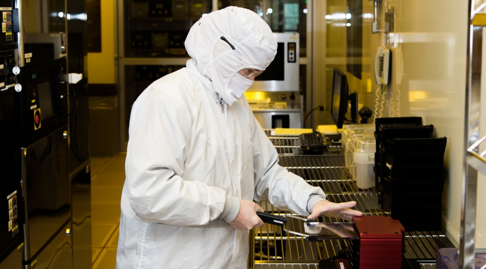 A staff member fabricates a wafer in the Microelectronics Laboratory.