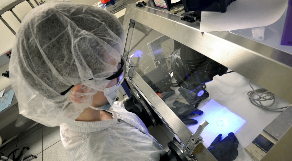Valerie Finnemeyer of the Advanced Imager Technology Group fabricates a thin-film Pancharatnam phase device (PPD), also called a liquid crystal polarization grating, at a Lincoln Laboratory processing facility.