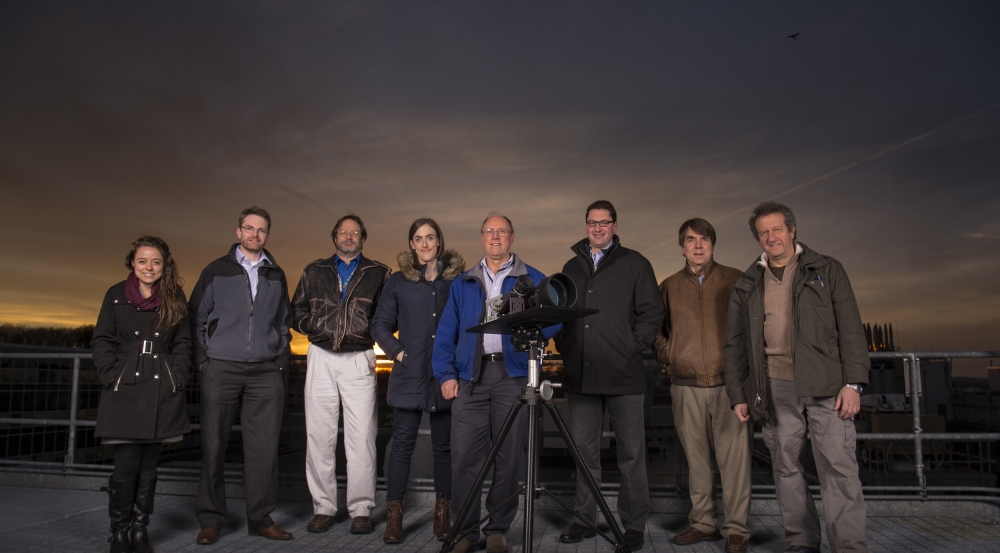 The test team with one of the LASSOS sensors on the roof of Lincoln Laboratory's B-building. 
