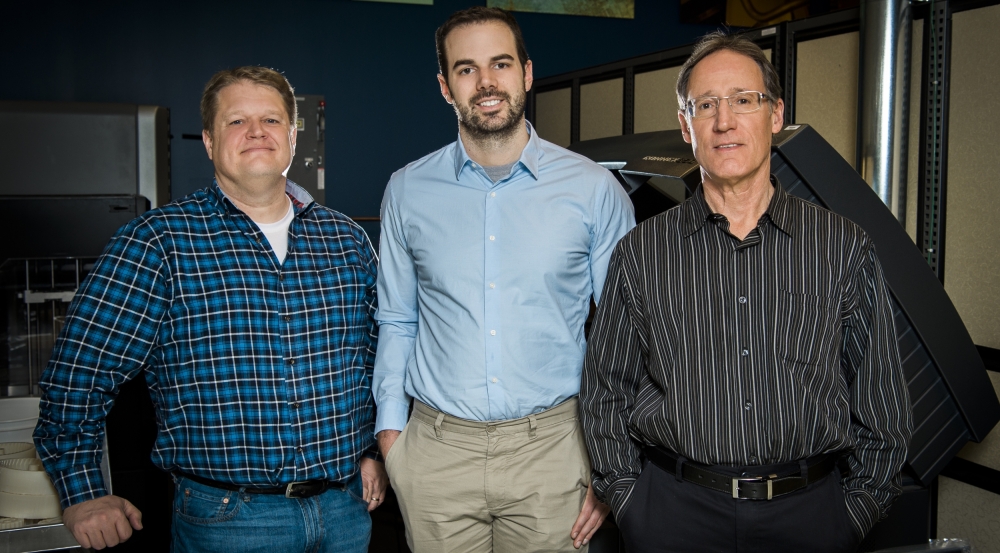 Peter Carr, left, and David Walsh, center, worked with David Scott, right, manager of Lincoln Laboratory's makerspace, the Technology Office Innovation Laboratory, to create a variety of functional devices.