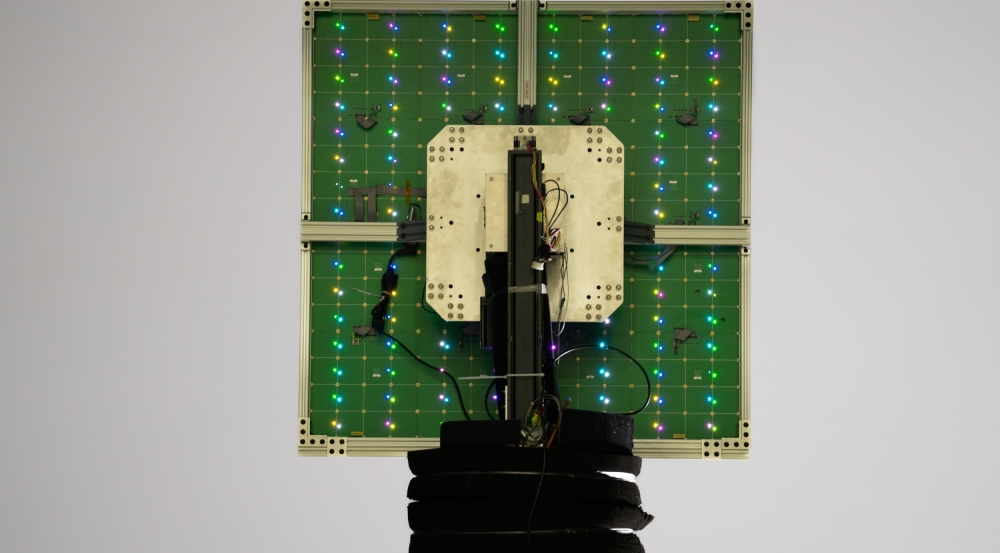 A scanning reflectarray antenna lights up with its individual reflective elements.