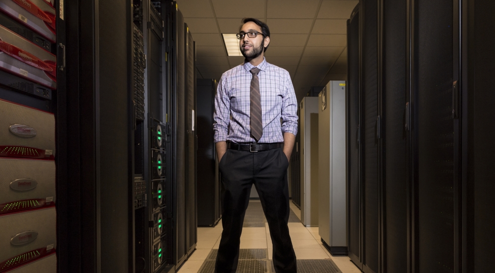 Vijay Gadepally stands in the Lincoln Laboratory Supercomputing Center