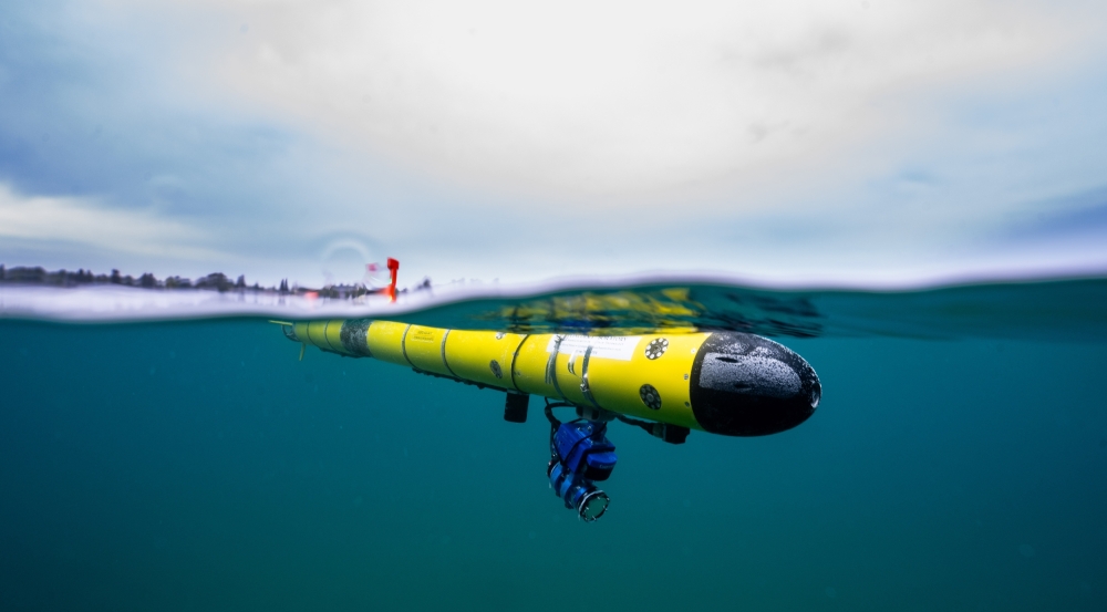 A photo of an underwater robot just under the water's surface. 