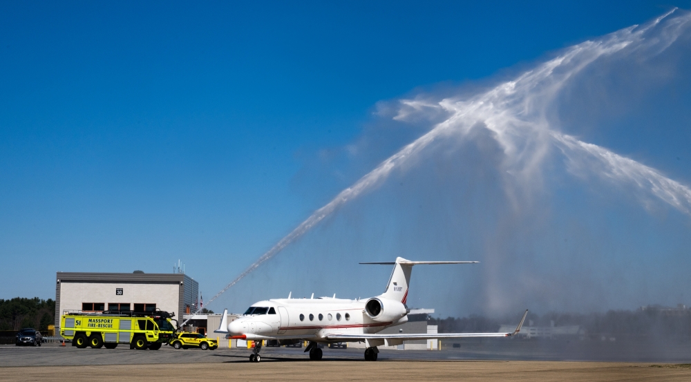 Water shoots over an aircraft.