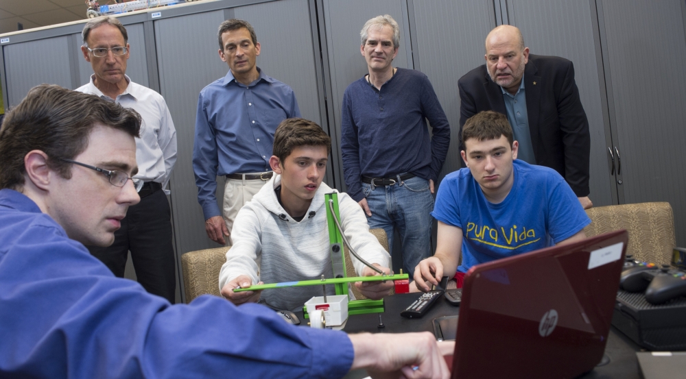 Laboratory staff help students in Explorer Post understand the functionality of seismic monitoring instrumentation.