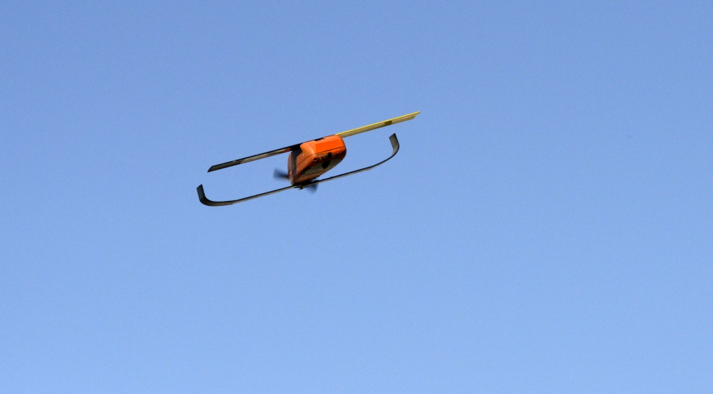 This miniature unmanned aerial vehicle is capable of autonomous navigation, including coordinated maneuvering within a large group of autonomous UAS.