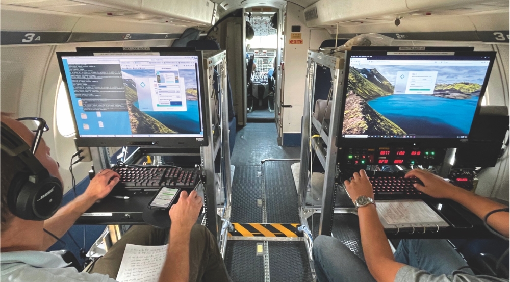 A photo of two operators on an aircraft using the Laboratory's Airborne Radar Testbed to command a radar to test and demonstrate intelligence, surveillance, and reconnaissance radar concepts.