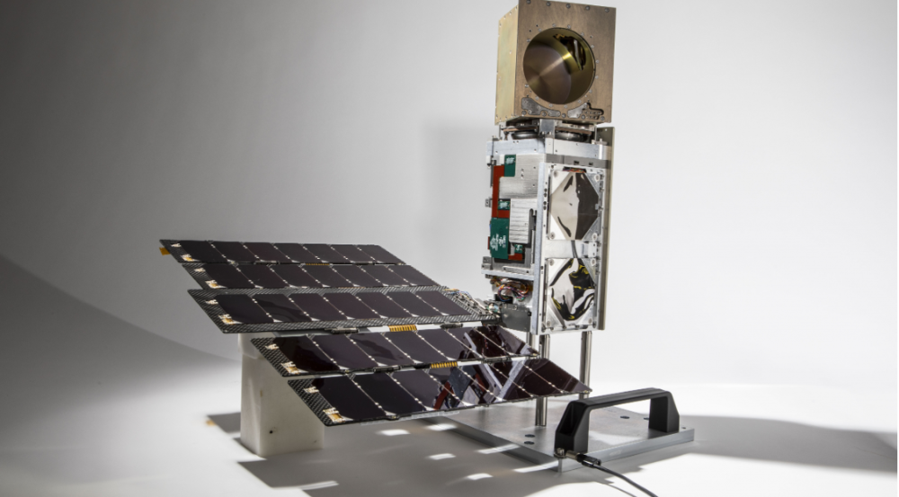 a photo of a small satellite in a studio