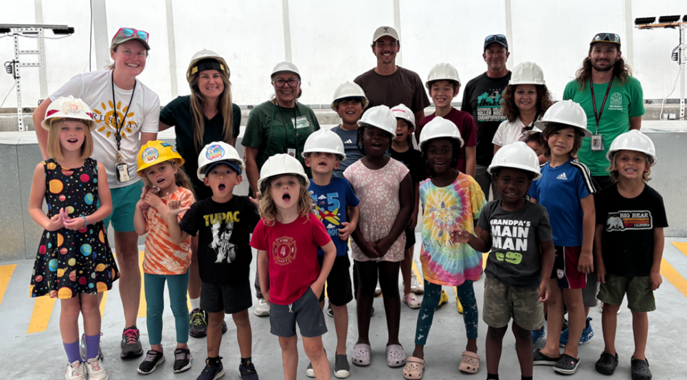 for SPACEWK-1: 14 school children from grades 1-6 wear hard hats as they tour the inside of a Ground-Based Radar dome, accompanied by several teachers and guided by several Lincoln Laboratory staff members.