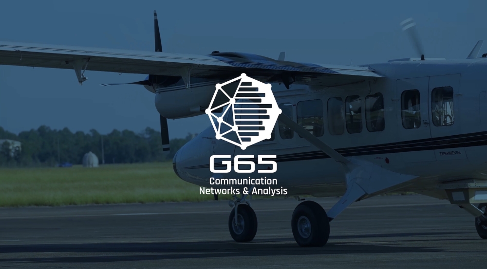 The Communications & Network Analysis Group logo with a plane in the background.